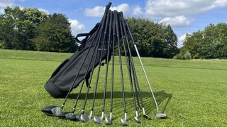 The Inesis 100 Package Set with clubs resting on the black stand bag