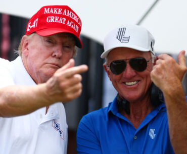Former President Donald Trump and LIV Golf CEO Greg Norman speak at the first tee during a LIV Golf tournament at Trump National Doral Golf Club in Miami on April 7.