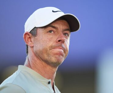 McIlroy battles into three way share of lead in Dubai