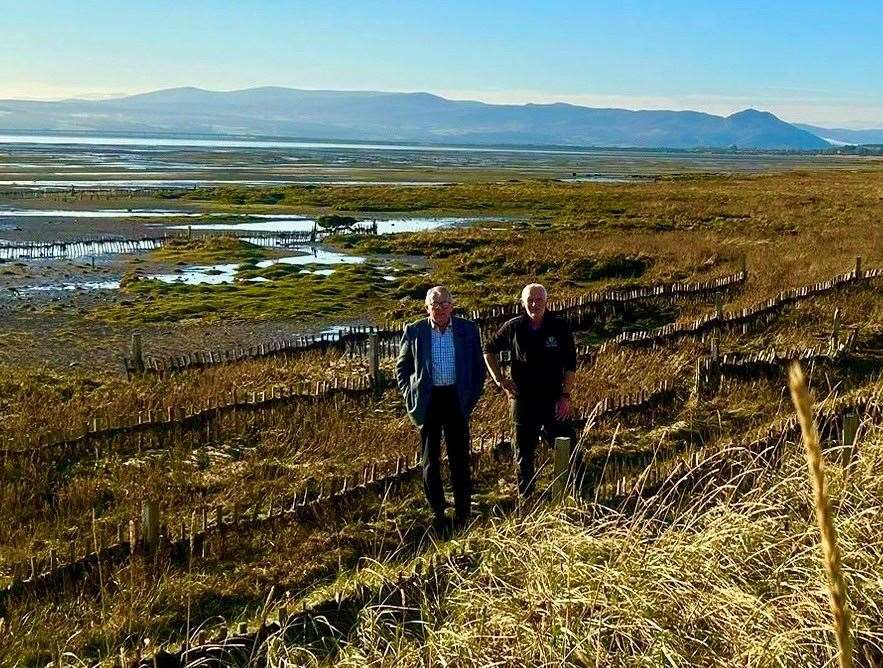 MP Jamie Stone with Royal Dornoch Golf club course managr Eoin Riddell at the area of salt grass planting on the 10th hole of the Struie course.