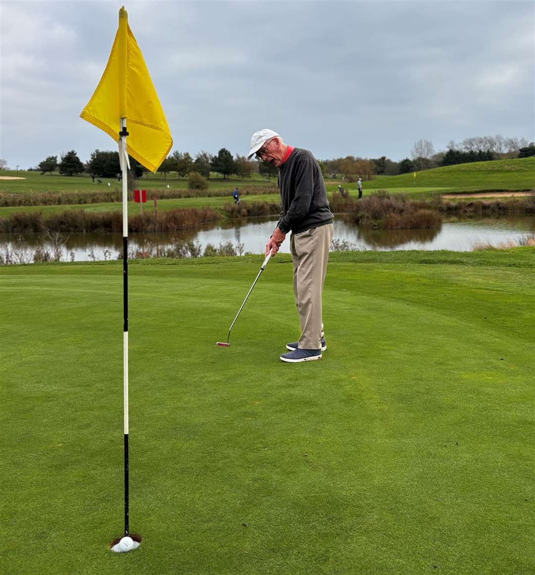 John Duffy sinks a putt on the green. Picture: Ashleigh Moore
