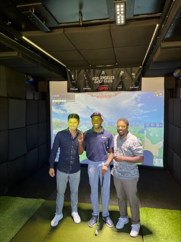 Attendees — including PGA Tour golfer Collin Morikawa, left —...