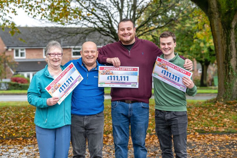 Gleeful neighbours show off their £111,111 cheques -Credit:MARK FLYNN