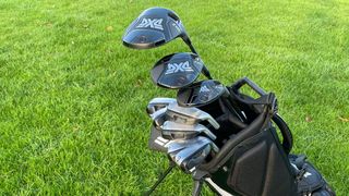 A close-up of the PXG 0211 Z Golf Club Set on a grass background