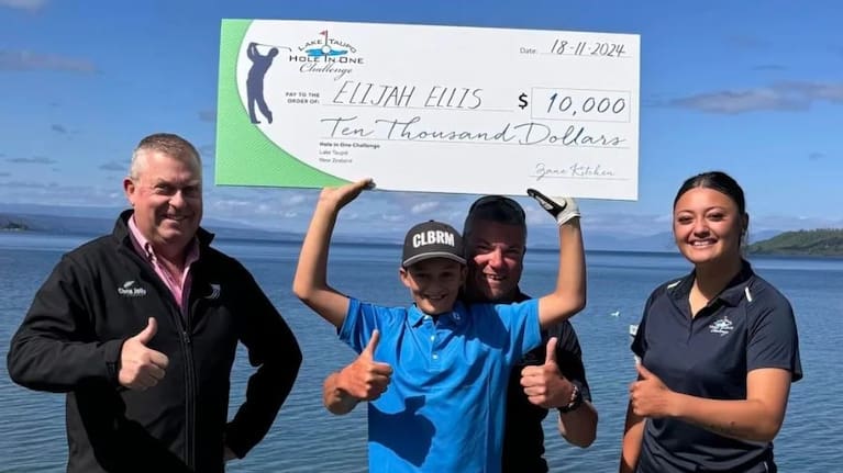 Elijah Ellis with his $10,000 cheque after winning the Hole in One Challenge at Lake Taupō. 