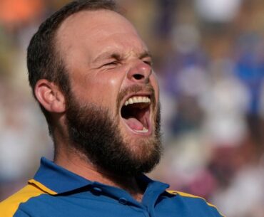 Europe's Tyrrell Hatton celebrates after winning his singles match on the 16th green 3&2 at the Ryder Cup golf tournament at the Marco Simone Golf Club in Guidonia Montecelio, Italy, Sunday, Oct. 1, 2023. (AP Photo/Alessandra Tarantino)