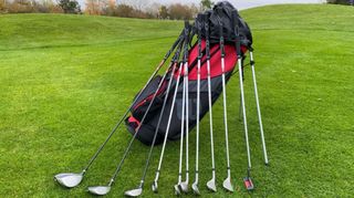 The Wilson Prostaff SGI Package Set with the golf clubs resting on the stand bag