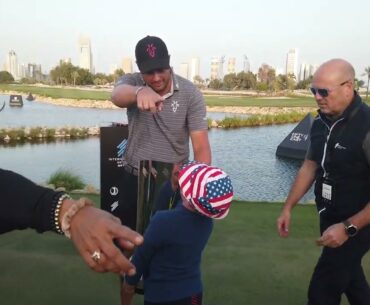 Fan moment for young American fan at International Series Qatar at Doha Golf Club