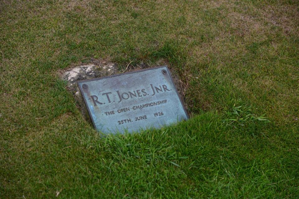 A plaque honoring Bobby Jones for his shot out of fairway bunkers to win the 1926 Open Championship at Royal Lytham.