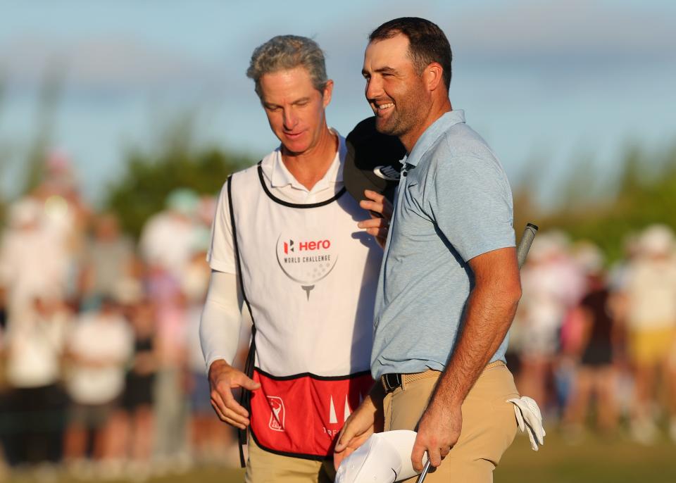 Scottie Scheffler of the United States and caddie, Ted Scott, celebrate after winning the Hero World Challenge 2024 at Albany Golf Course on December 08, 2024 in Nassau, Bahamas. (Photo by Kevin C. Cox/Getty Images)