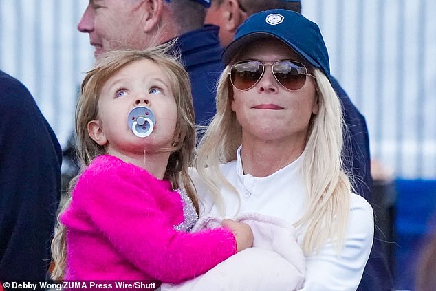 Nordegren pictured watching Tiger Woods and their son Charlie competing in Florida