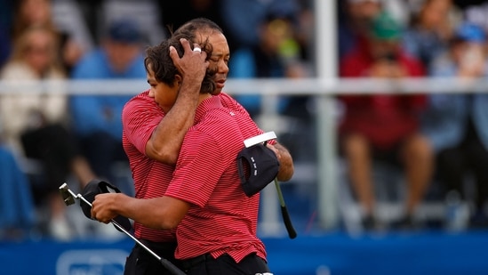 Tiger Woods of the United States with his son Charlie Woods and daughter Sam Woods walk on the first hole during the second round of the PNC Championship at Ritz-Carlton Golf Club on December 22(Getty Images via AFP)