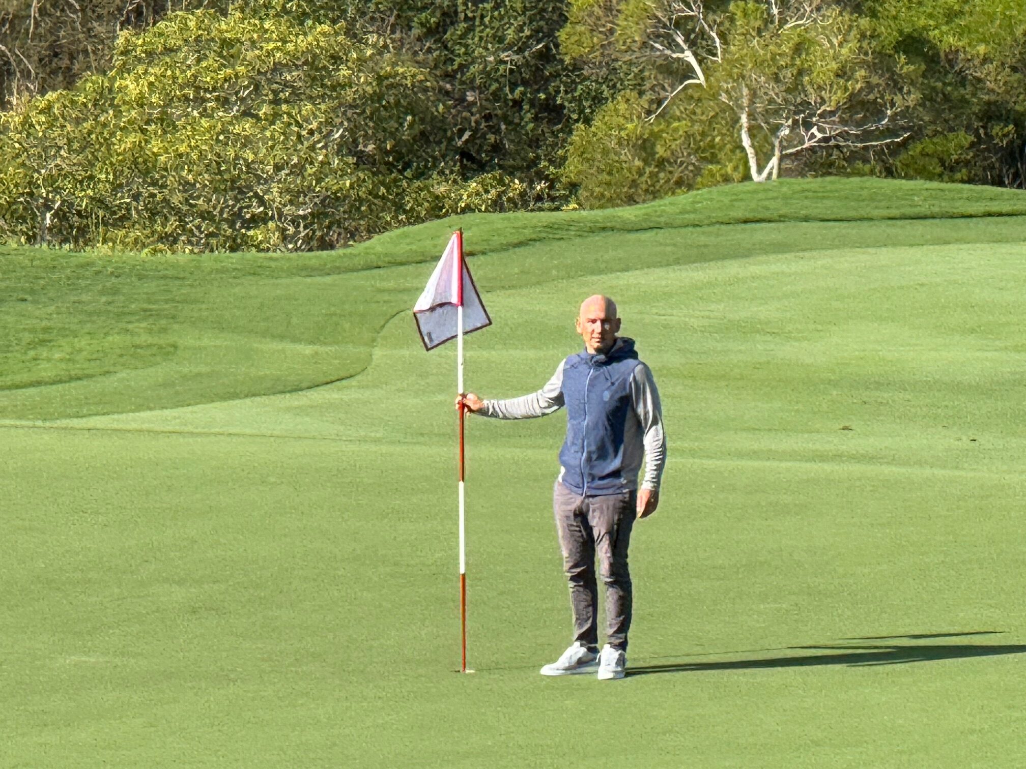 Max Novena, executive director of The Sentry golf tournament, stands on the ninth green of the Kapalua Plantation Course on Thursday. HJI / ROB COLLIAS photo