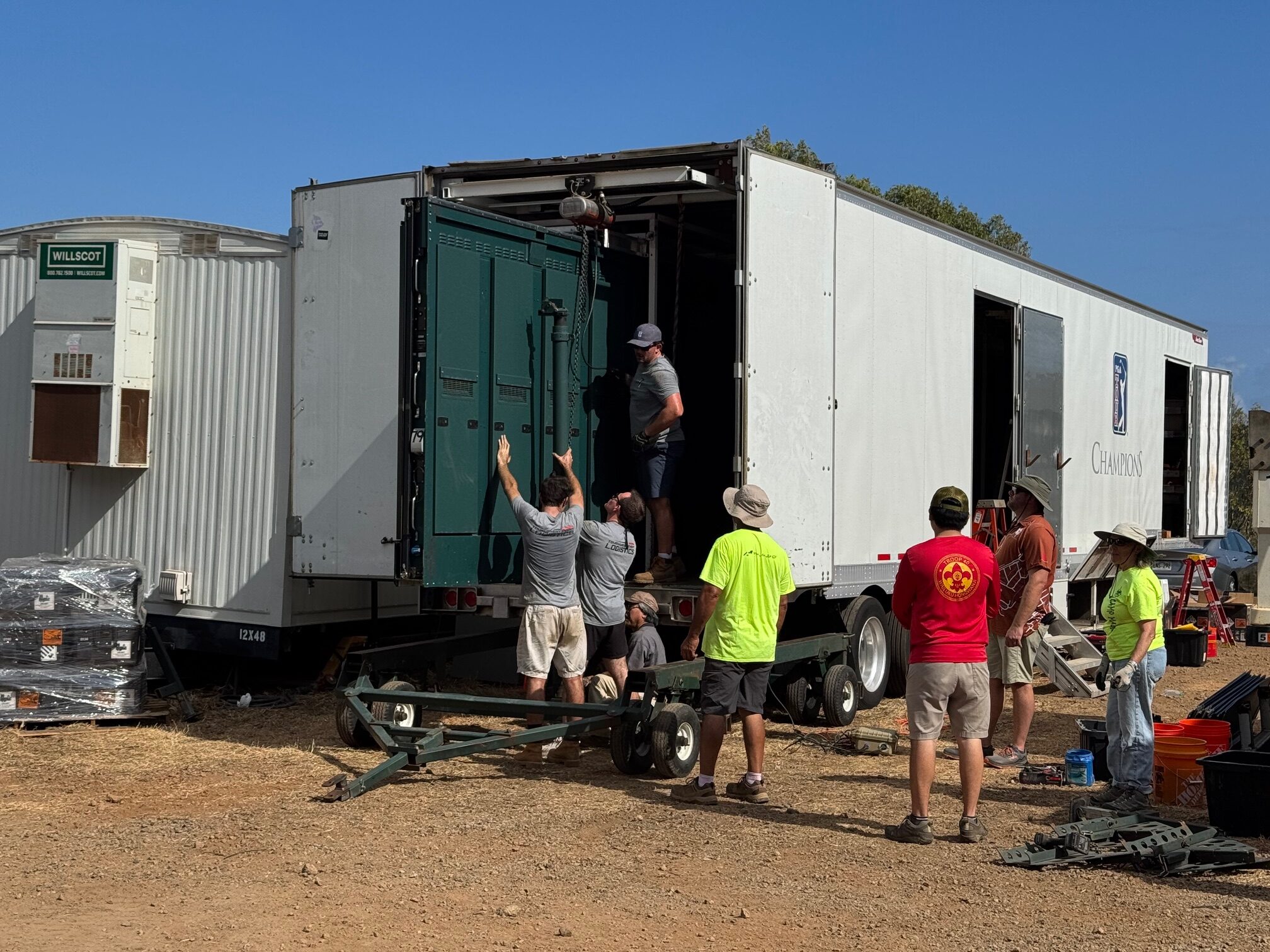 Workers at The Sentry golf tournament prepare to move a scoreboard into place on Friday at the Kapalua Plantation Course. HJI / ROB COLLIAS photo