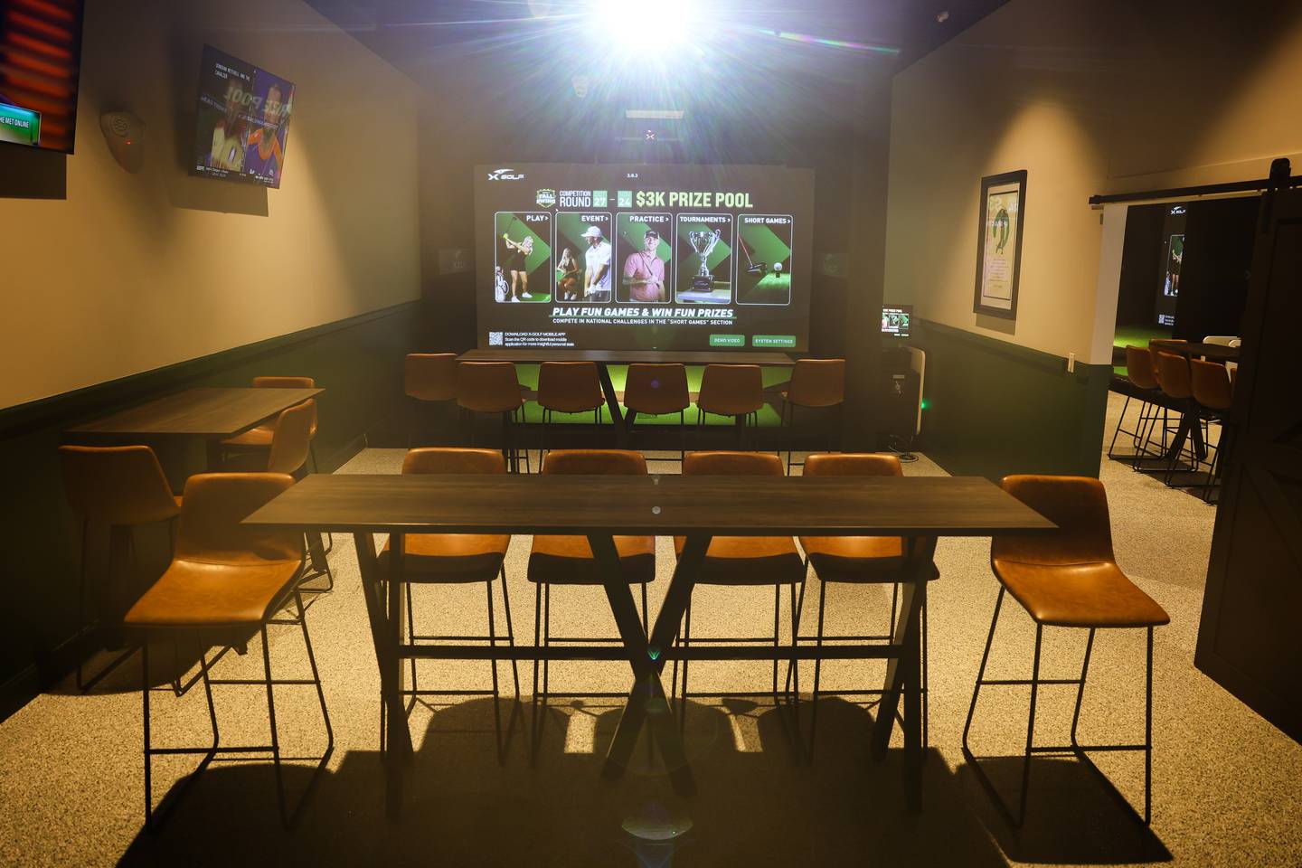 X-Golf includes a private executive area with two virtual golfing experiences.