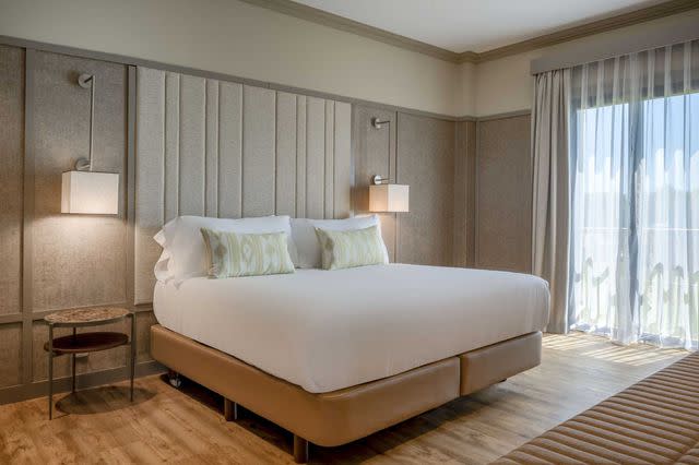 Miguel Merino/Courtesy of Hacienda Son Antem Golf Resort, Autograph Collection Interior of a Superior King Terrace guest room