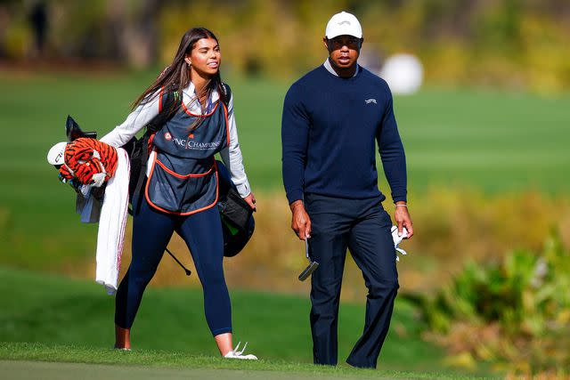 Mike Ehrmann/Getty Tiger Woods and daughter Sam Woods walk the fifth hole during the PNC Championship at the Ritz-Carlton Golf Club in Orlando on Dec. 21, 2024
