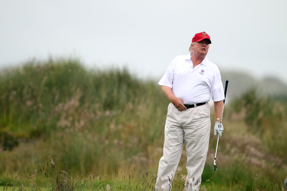 Donald Trump playing golf.