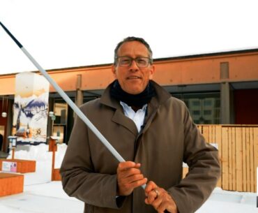 Richard Quest Learns About Upcoming Global Challenges over a Round of Ice Hockey Mini Golf