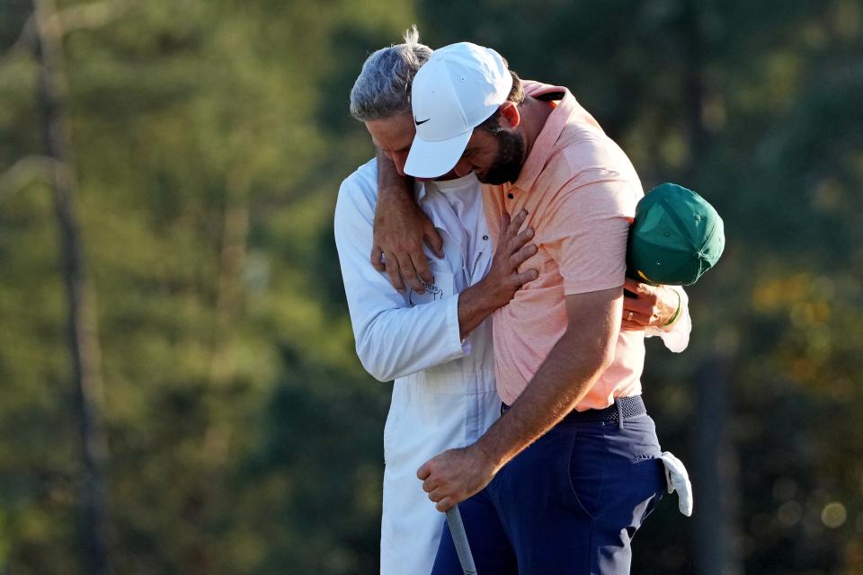 Scottie Scheffler hugs his caddie Ted Scott on the 18th green after winning the 2024 Masters. (Photo: Kyle Terada-USA TODAY Sports)