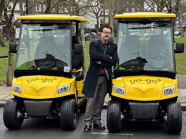 MailOnline reporter Jon Brady with two of the Yo-Go buggies that can be hired and driven across London