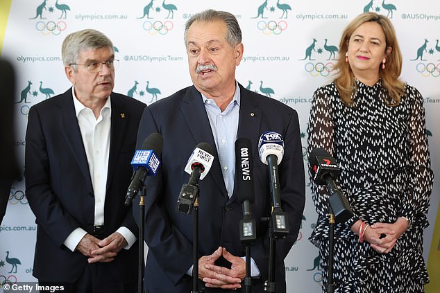 Norman was appointed to the role by Brisbane Olympics president Andrew Liveris (centre)
