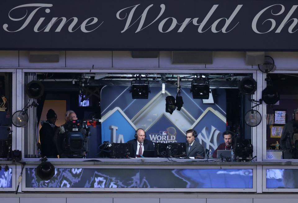 Fox broadcasters John Smoltz and Joe Davis are seen in the eighth inning of Game Three of the 2024 World Series between the Los Angeles Dodgers and New York Yankees at Yankee Stadium on October 28, 2024 in the Bronx borough of New York City.