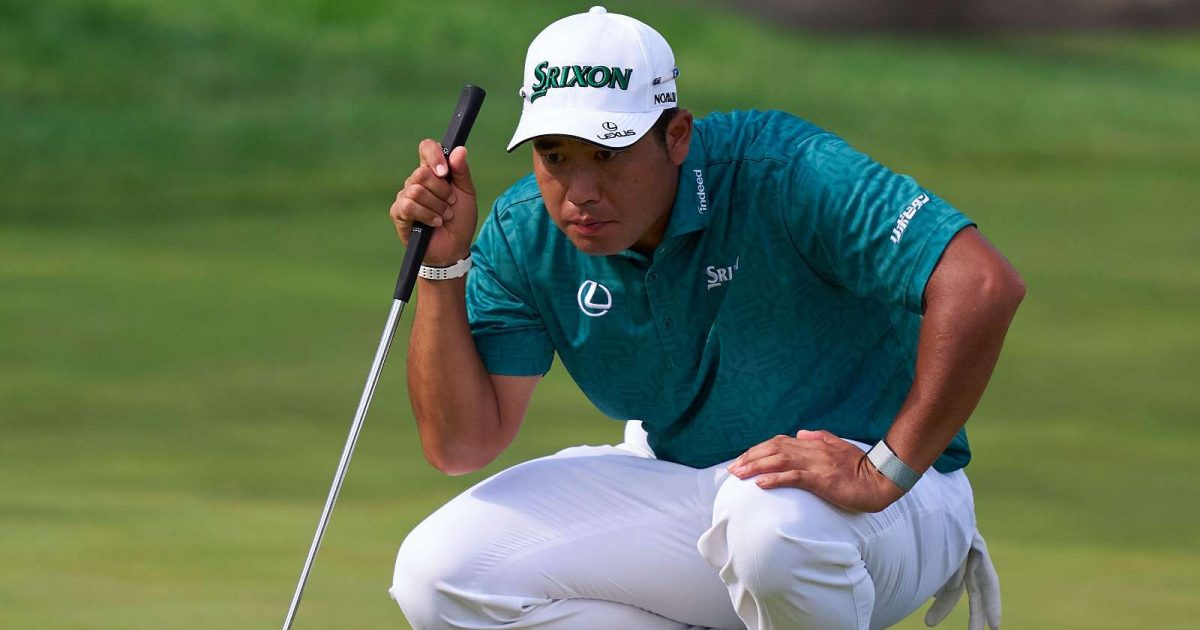Hideki Matsuyama lines up a putt