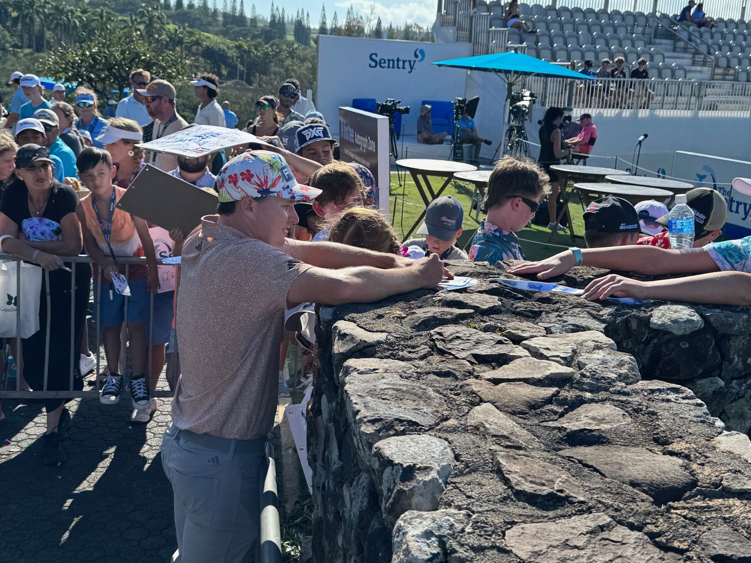 Matt McCarty signs an autograph after he finished his final round of The Sentry on Sunday at the Kapalua Plantation Course. McCarty finished tied for 53rd at 8-under par. HJI / ROB COLLIAS photo