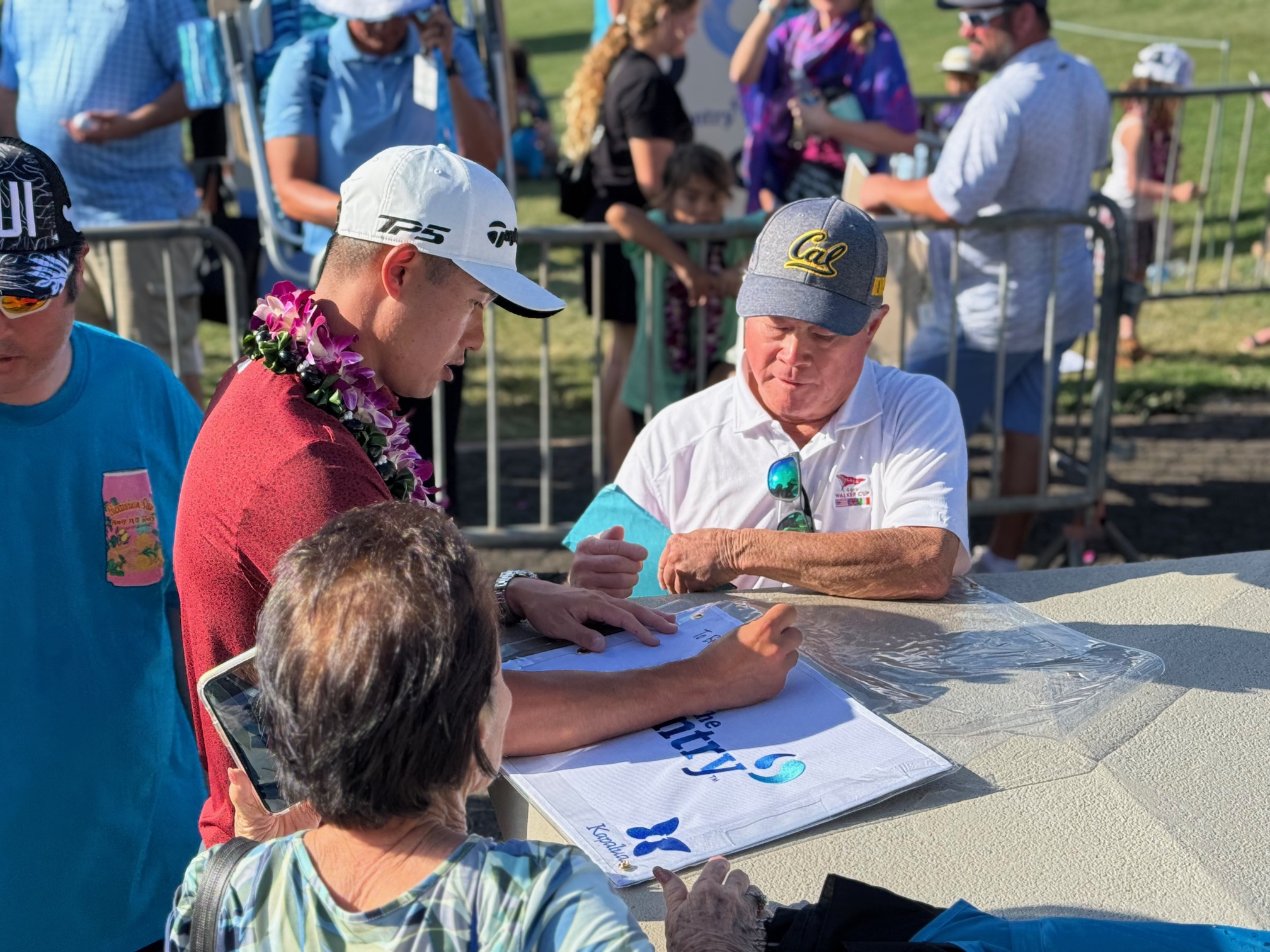 Collin Morikawa signs an autograph after finising second at The Sentry on Sunday at the Kapalua Plantation Course. HJI / ROB COLLIAS photo