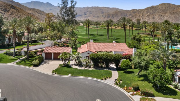 The property abuts the golf course and offers views of...
