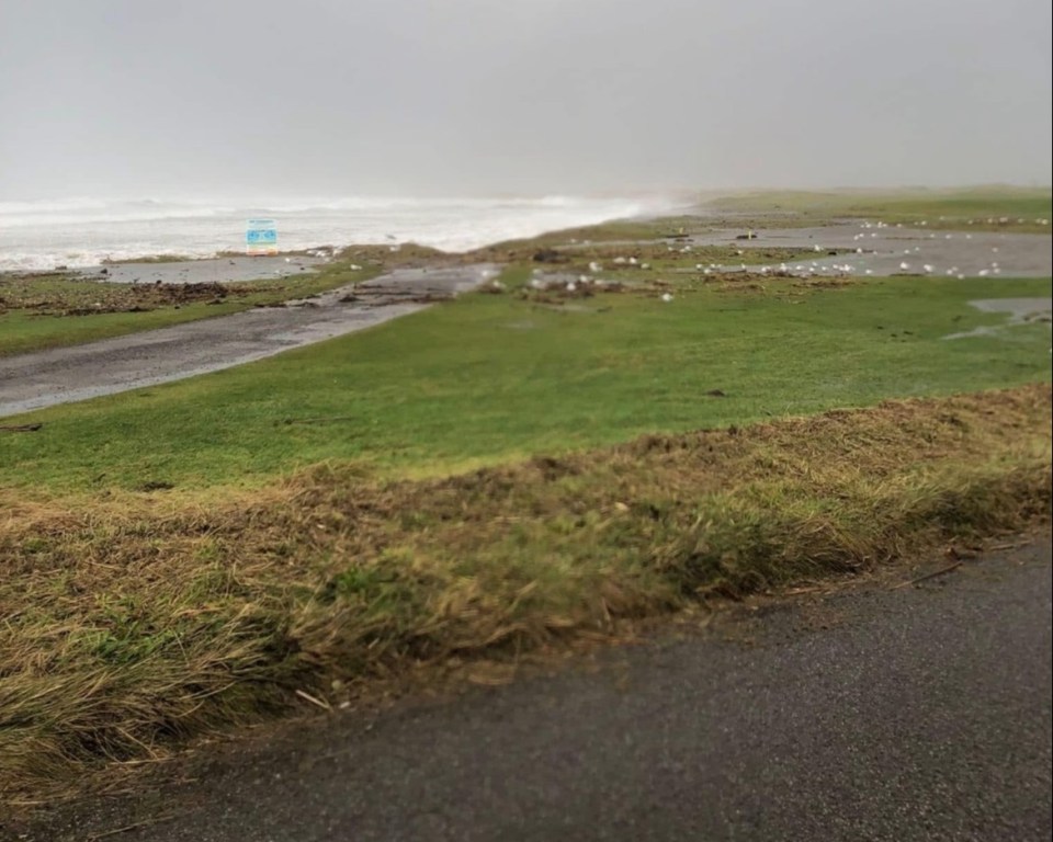 Flooded road near the ocean.