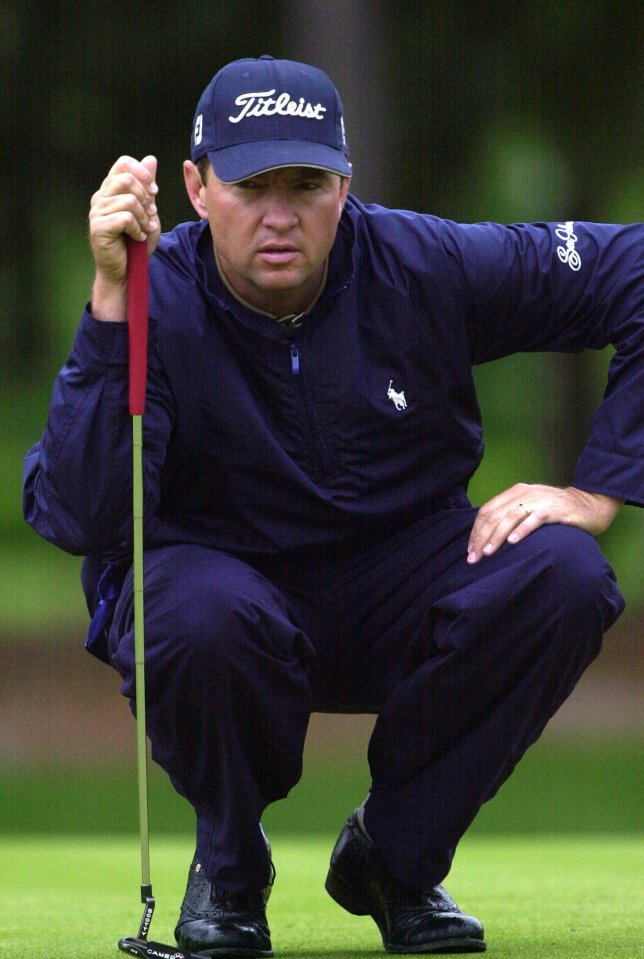 Davis Love III lining up a putt.