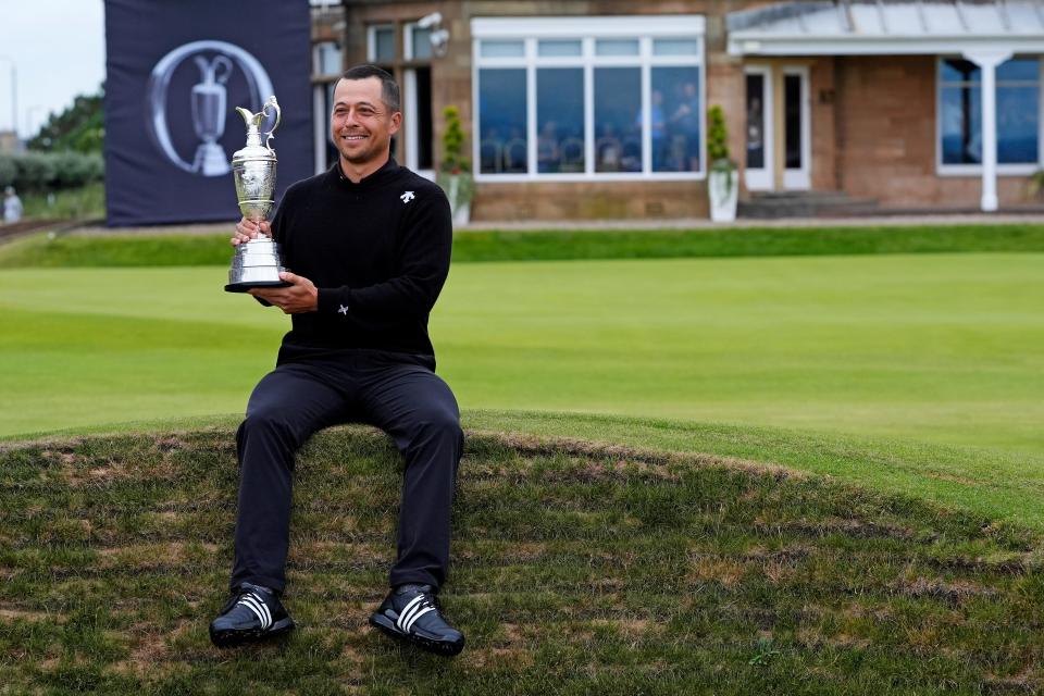 Xander Schauffele celebrates with the Claret Jug on the 18th green in celebration of victory at the 152nd Open Championship at Royal Troon.