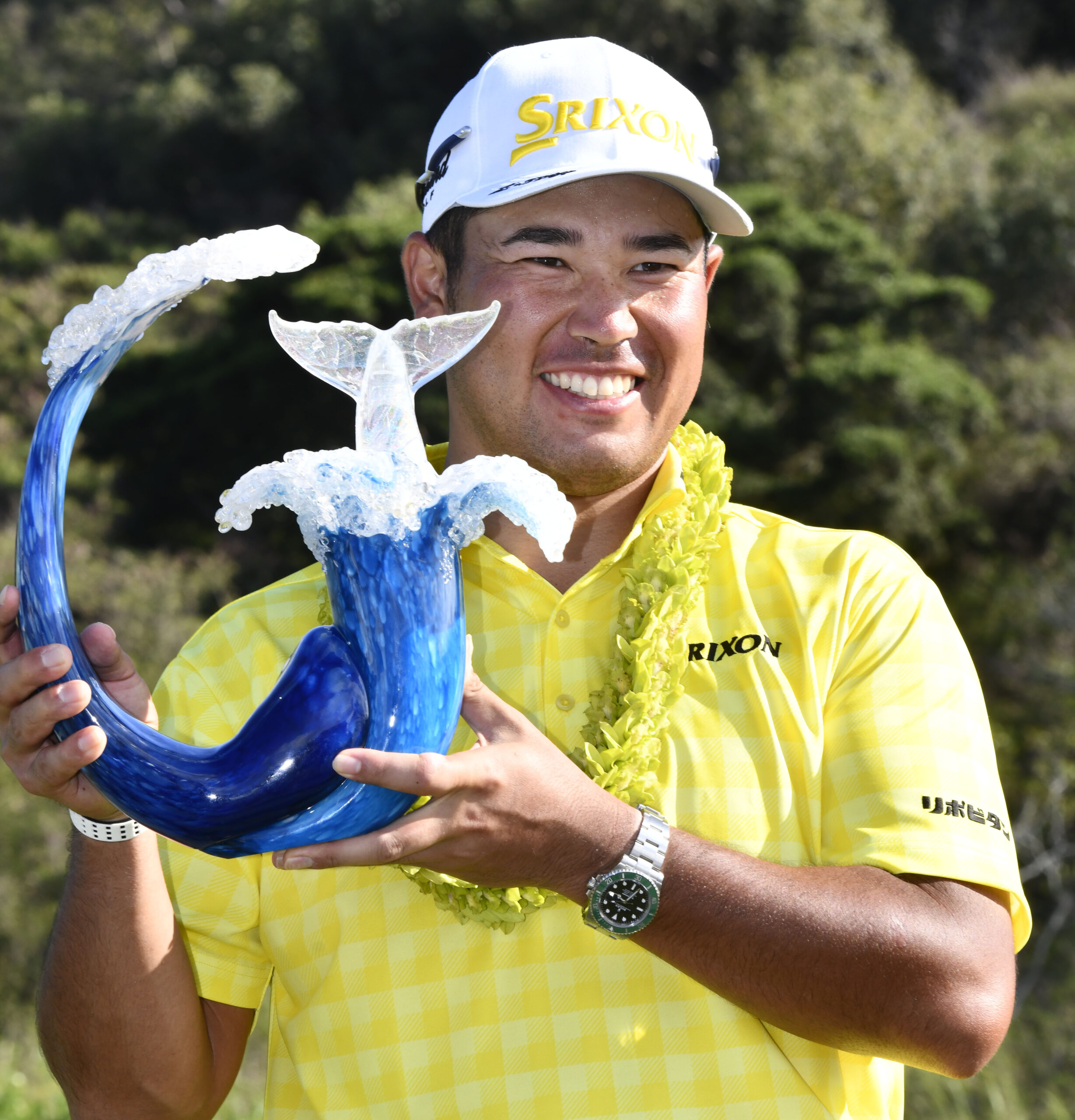 Hideki Matsuyama poses with The Sentry winner's trophy Sunday afternoon on the Kapalua Plantation Course's 18th green. Maui Photojournalism Magazine / MATTHEW THAYER photo