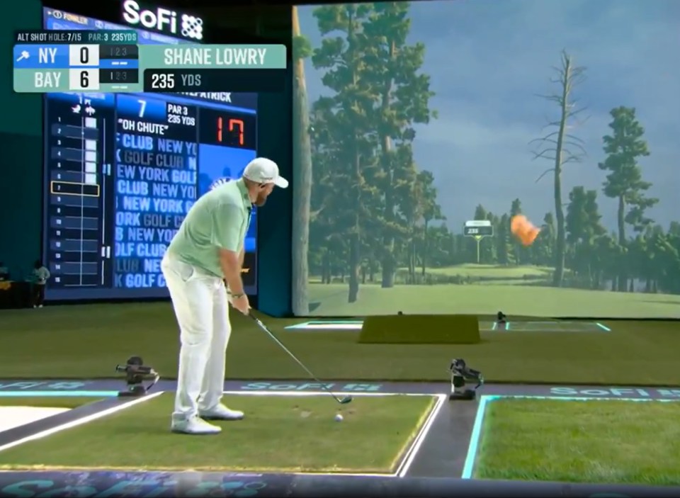Shane Lowry taking a shot in a golf simulator; the scoreboard shows NY 0, Bay 6.