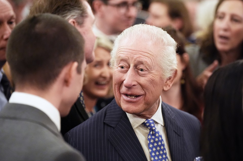 King Charles III speaking with someone.