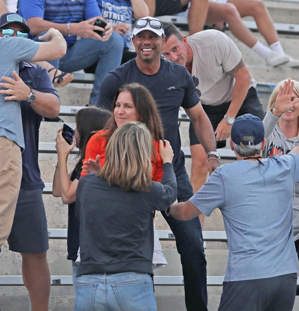 Tiger Woods celebrates with parents after his daughter Sam Woods team wins the FHSAA semi-finals soccer tournament in DeLand, Thursday, Feb.27,2025