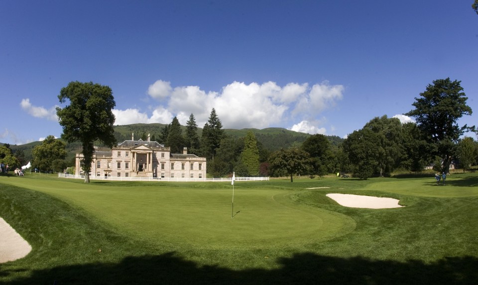 Golf course with clubhouse in the background.