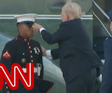 Trump stops to retrieve Marine's hat
