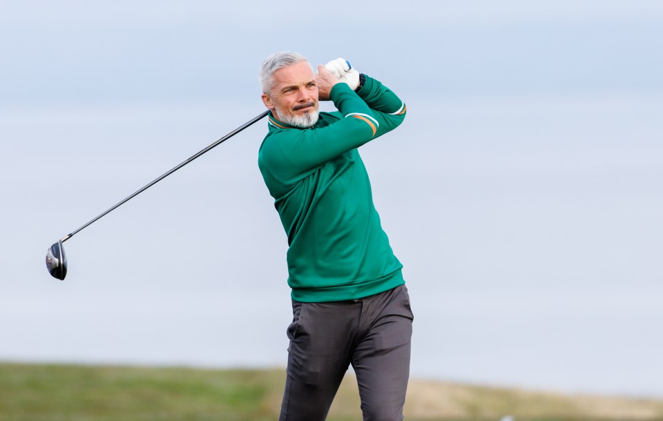 A golfer taking a swing.