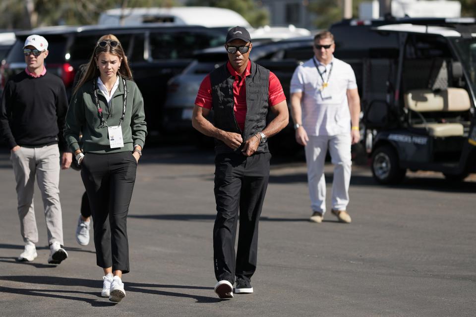 Kai Trump and Tiger Woods arrive at Torrey Pines during the final round of the 2025 Genesis Invitational at Torrey Pines.