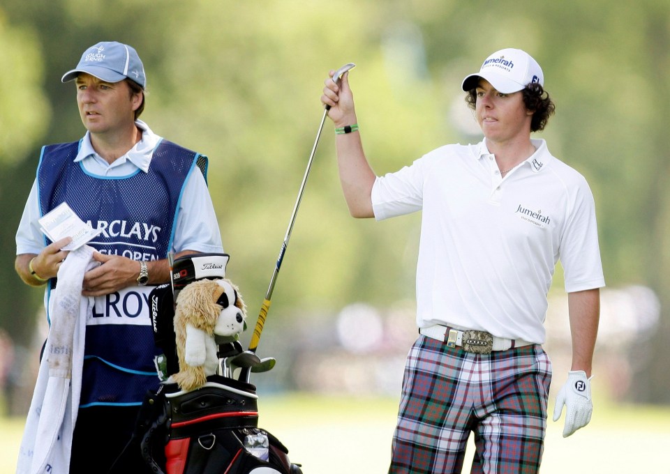 Rory McIlroy and his caddie at a golf tournament.