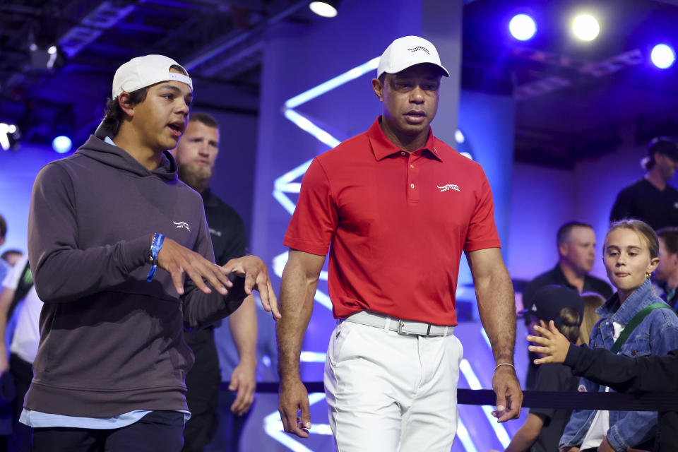 Tiger Woods and son Charlie prepare for Tuesday night's TGL match. (Megan Briggs/TGL/TGL via Getty Images)