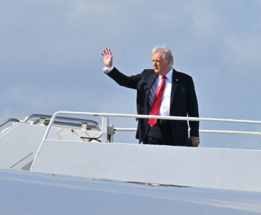 Donald Trump boards Air Force One in Florida as he heads to New Orleans for the Super Bowl