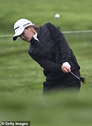 Trump plays a shot on the ninth hole of the course