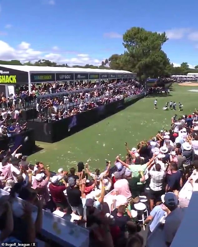 Patrick Reed fired up the crowd before his ace, ensuring he was a fan favourite (pictured)
