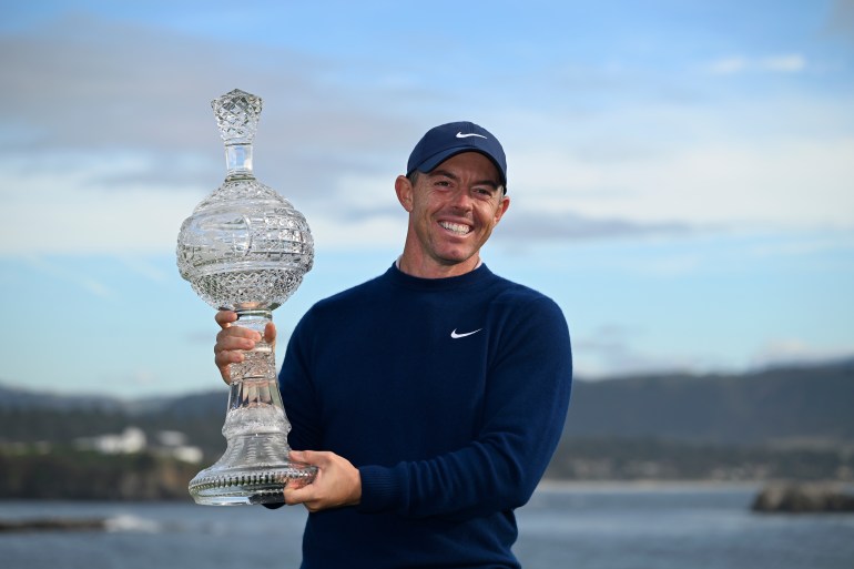 Rory McIlroy, of Northern Ireland, celebrates at Pebble Beach Golf Links after winning the AT&T Pebble Beach Pro-Am golf tournament, Sunday, Feb. 2, 2025, in Pebble Beach, Calif. (AP Photo/Nic Coury)