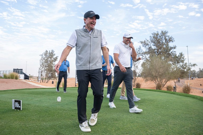 LIV Golf CEO, Scott O'Neil laughs while playing with Captain Brooks Koepka of Smash GC, Paul Danforth and Jordan Bazant during the pro-am before the start of LIV Golf Riyadh at Riyadh Golf Club on Wednesday, February 05, 2025 in Riyadh, Saudi Arabia. (Photo by Charles Laberge/LIV Golf via AP)