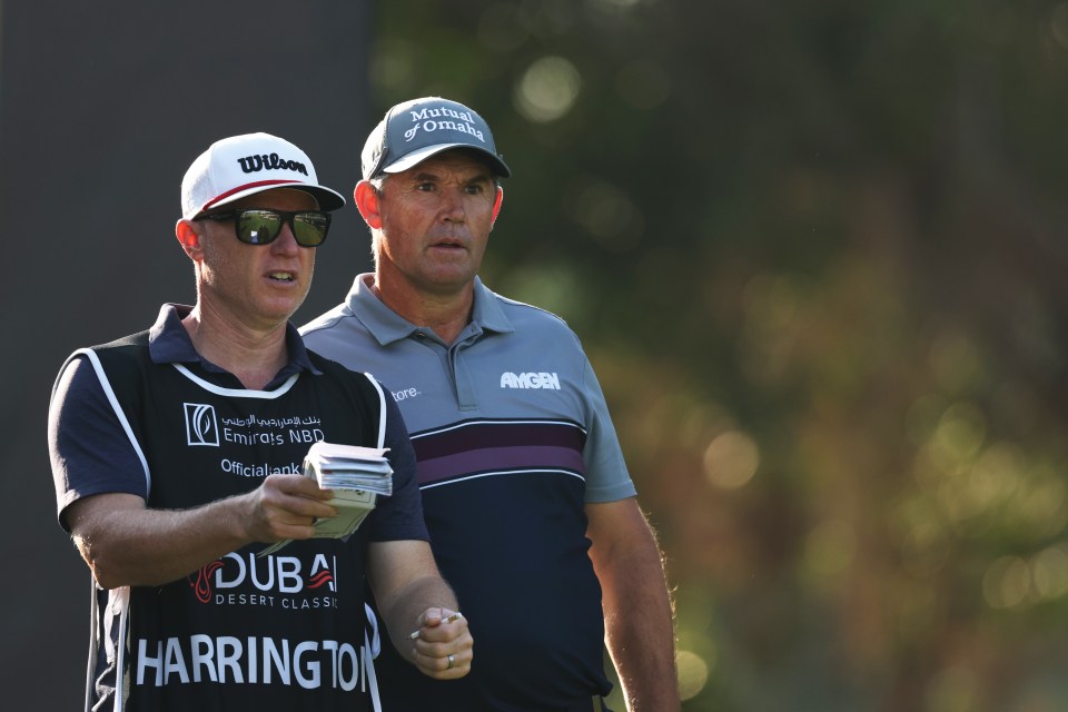 DUBAI, UNITED ARAB EMIRATES - JANUARY 16: Padraig Harrington of Ireland interacts with his caddie Ronan Flood on day one of the Hero Dubai Desert Classic at Emirates Golf Club on January 16, 2025 in Dubai, United Arab Emirates. (Photo by Richard Heathcote/Getty Images)